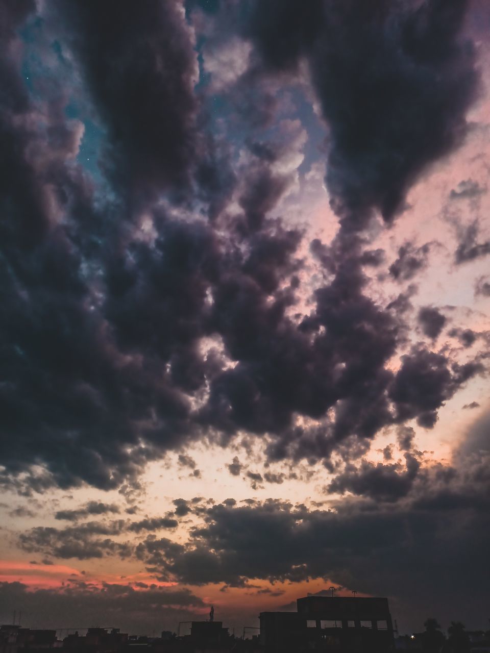 LOW ANGLE VIEW OF CLOUDY SKY DURING SUNSET