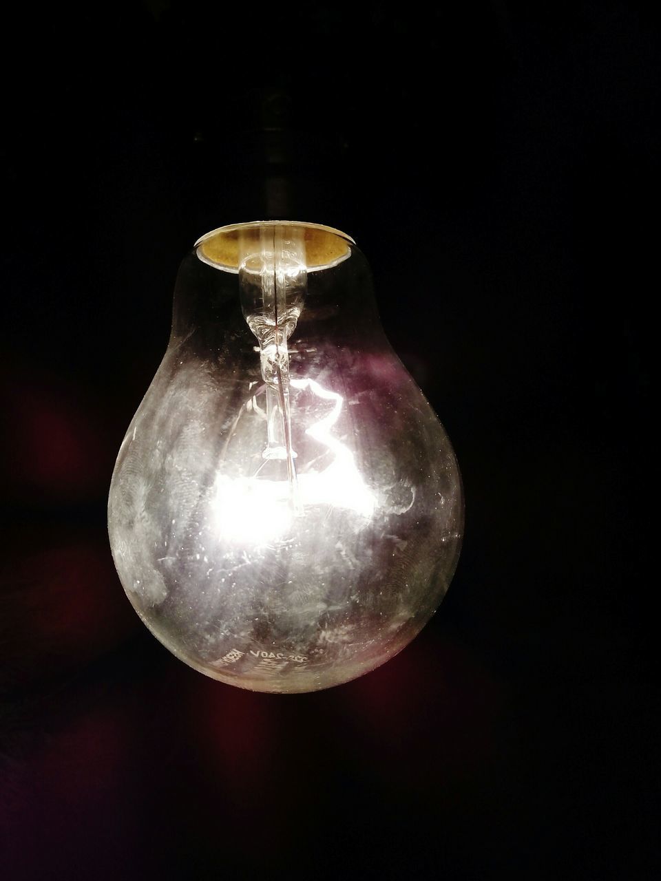 illuminated, lighting equipment, light bulb, electricity, indoors, hanging, close-up, electric light, glowing, night, low angle view, electric lamp, ceiling, chandelier, lit, dark, fuel and power generation, decoration, glass - material, light - natural phenomenon