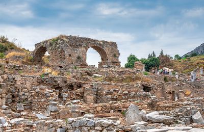 View of old ruins against cloudy sky