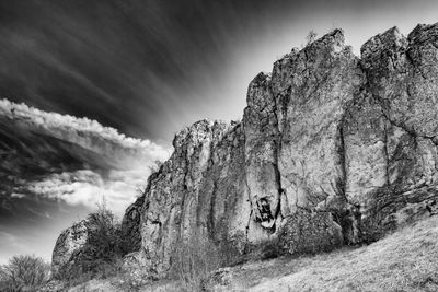 Low angle view of rock formations against sky