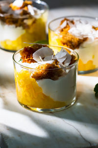 Piña con mousse de coco y bizcocho close-up of dessert on table