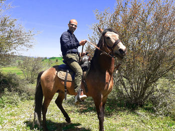 Man riding horse