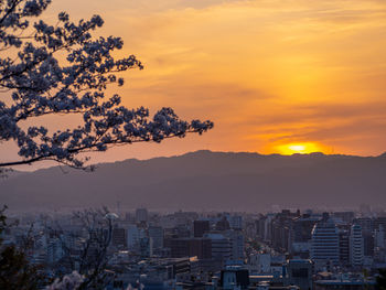 High angle view of buildings against sky at sunset