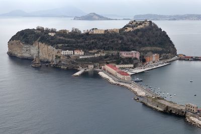 Panoramic view of sea and buildings against sky