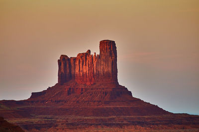 Low angle view of rock formations against sky