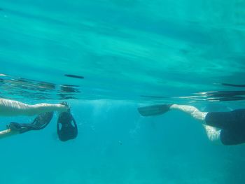 People swimming in sea