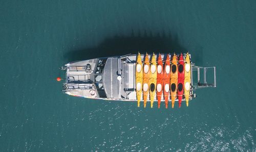 High angle view of ship moving on sea during sunny day