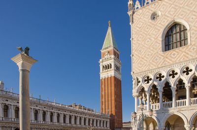 Piazza san marco in venice with the bell tower and the detail of the building