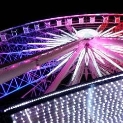 Low angle view of illuminated ferris wheel