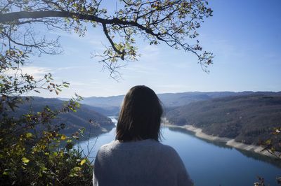 Scenic view of lake with mountains in background