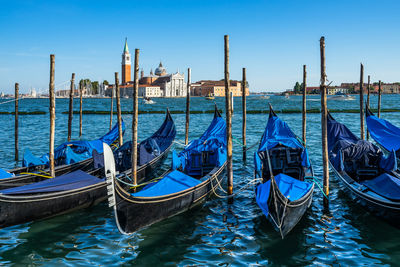 Empty gondolas near st. mark's square with the church of san giorgio, venice, italy