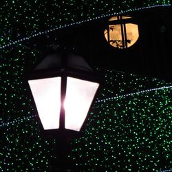 Low angle view of illuminated lantern at night