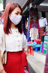 Young woman standing at store