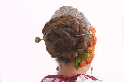 Rear view of woman wearing hat against clear sky