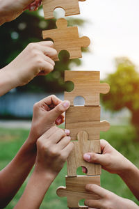 Cropped hands of woman holding toy blocks