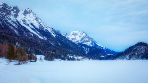 Scenic view of snowcapped mountains against sky