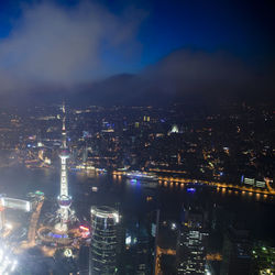 High angle view of illuminated buildings in city at night