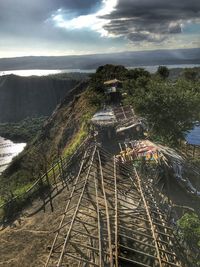 Aerial view of sea and mountain against sky