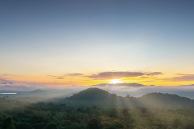 Scenic view of mountains against sky during sunset