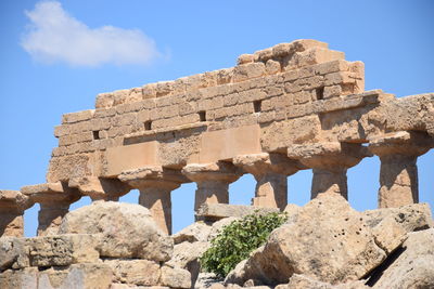 Low angle view of old ruins against sky