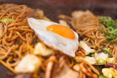 Close-up on yakisoba japanese noodles cooked on a hot plate