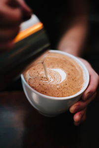 Close-up of coffee cup on table