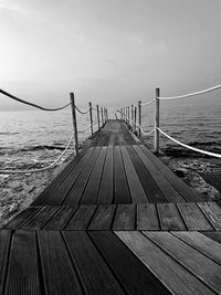 Pier over sea against sky