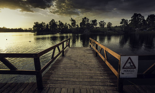 Pier over lake against sky