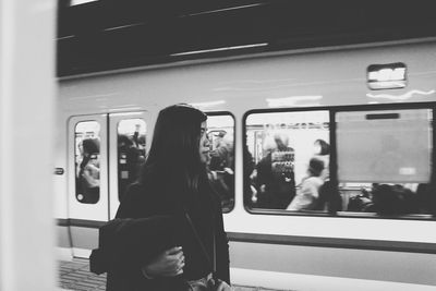A woman waiting for the train, starting her journey to seek for a better future in life