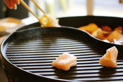 Close-up of meat on grill pan