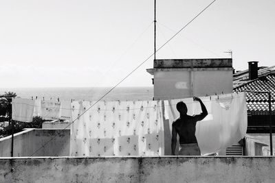 Woman standing against wall