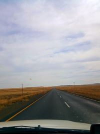 Road seen through car windshield