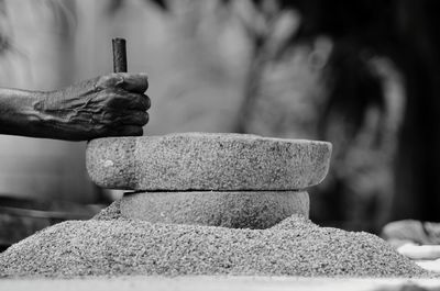 Close-up of hand holding sculpture