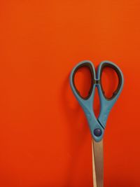 Directly above shot of lamp against orange wall