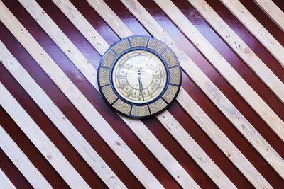 Close-up of clock on wood