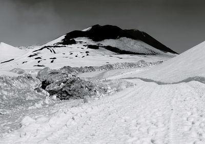 Scenic view of snow covered mountain against sky