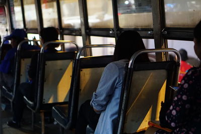 Full length of man sitting in train