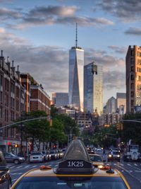 City street against cloudy sky