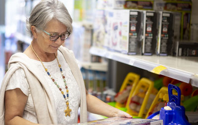 Senior woman standing in supermarket