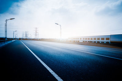 Empty road against sky
