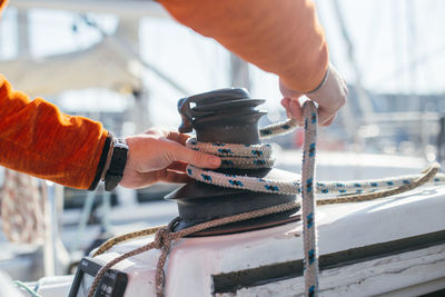 Close-up of man working on boat