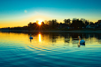 Scenic view of lake at sunset