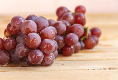 Close-up of grapes in plate on table