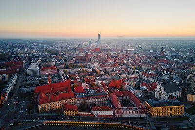 High angle view of city at sunset