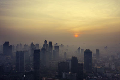 Cityscape against sky during sunset