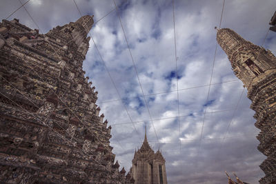 Low angle view of historic building against cloudy sky