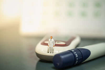 Close-up of cigarette toy on table