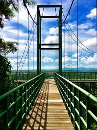 Footbridge against sky