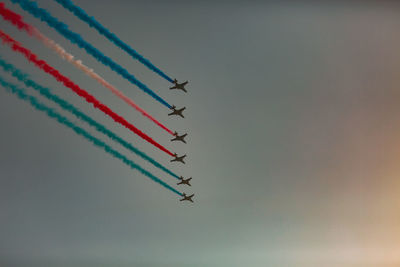 Low angle view of airplane flying against sky