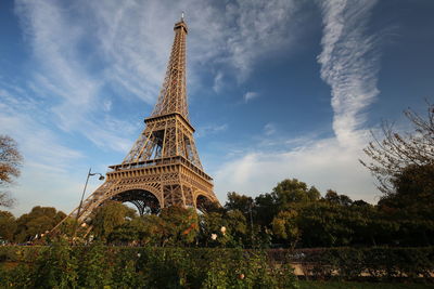 Low angle view of tower against cloudy sky